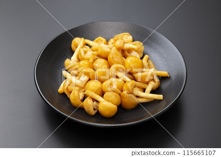 Nameko mushroom on black background Nameko mushroom on black background 115665107