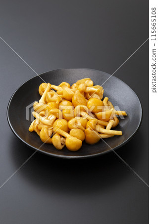 Nameko mushroom on black background Nameko mushroom on black background 115665108