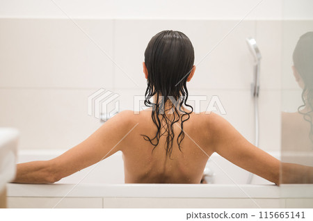 Waist up picture of a nude woman in a shower Waist up picture of a nude woman in a shower 115665141