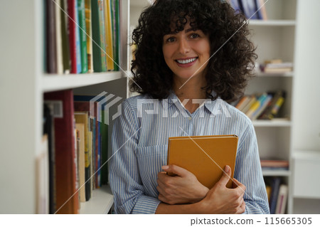 Woman student studying educating with good mood in library Woman student studying educating with good mood in library 115665305