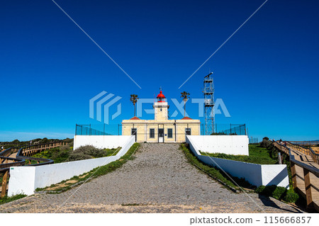 The lighthouse at Ponta da Piedade, a unique rock formation with famous grottos in the ocean at Lagos, Algrave, Portugal 115666857