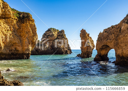 Ponta da Piedade is a unique rock formation with famous grottos in the ocean at Lagos, Algrave, Portugal 115666859
