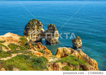 Ponta da Piedade is a unique rock formation with famous grottos in the ocean at Lagos, Algrave, Portugal 115666862
