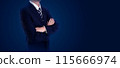 Businessman in a suit with arms crossed, standing against a dark background. Ideal for business, leadership, and professional concept 115666974