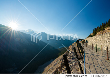 Columbia Icefield Skywalk. Snow-covered Rocky Mountains in the background. Jasper National Park, Alberta, Canada. Columbia Icefield Skywalk. Snow-covered Rocky Mountains in the background. Jasper National Park, Alberta, Canada. 115667083