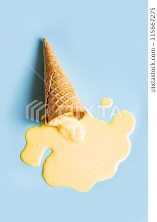 waffle cone with melted yellow ice cream waffle cone with melted yellow ice cream 115667275
