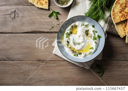 Labneh yogurt cream cheese dip with pita bread Labneh yogurt cream cheese dip with pita bread 115667437