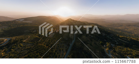 Sun setting behind mountain overlooking Prastio village. Limassol District, Cyprus Sun setting behind mountain overlooking Prastio village. Limassol District, Cyprus 115667788