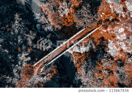 Aerial view of a stone medieval bridge over a rugged terrain. Akapnou village, Limassol District, Cyprus 115667836