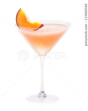 Peachy Keen Fruity pink cocktail in a wine glass garnished with a slice of peach Peachy Keen Fruity pink cocktail in a wine glass garnished with a slice of peach 115668566