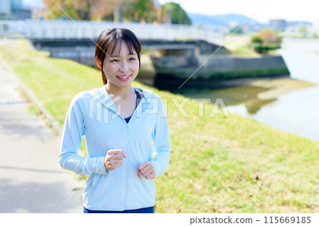 A young woman jogging in the city along the river Bodybuilding Diet A young woman jogging in the city along the river Bodybuilding Diet 115669185