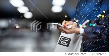 Girl makes a purchase with her phone on Black Friday. Girl makes a purchase with her phone on Black Friday. 115669253