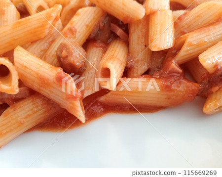 short pasta called penne with tomato sauce and sausage 115669269