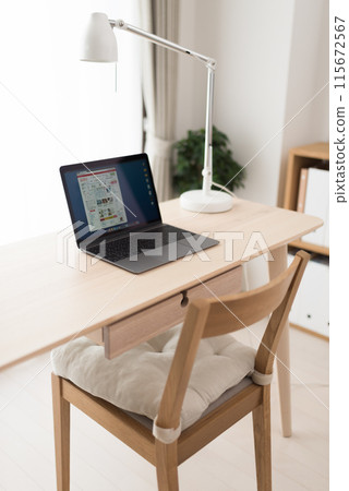 A room with a laptop and a desk A room with a laptop and a desk 115672567