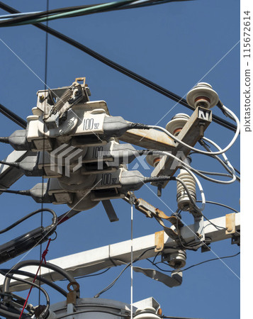 High voltage cutout attached to utility pole 115672614