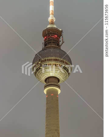 Famous Berlin Television Tower (Fernsehturm) with night sky background. 115673656