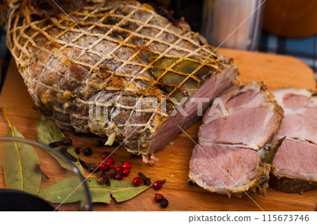 Boiled pork on chopping board with mixed peppercorns, bay leaf, cinnamon Boiled pork on chopping board with mixed peppercorns, bay leaf, cinnamon 115673746