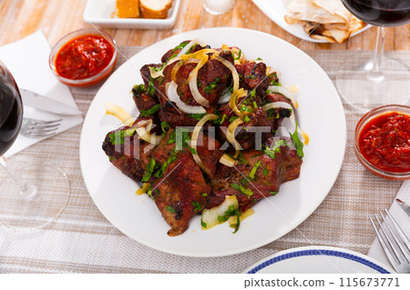 Barbecued pork shashlik with onion and herbs Barbecued pork shashlik with onion and herbs 115673771
