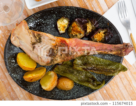 Lamb shoulder baked with new potatoes 115674015