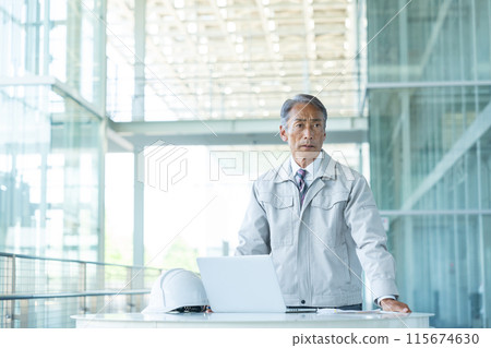 Senior man wearing work clothes 115674630