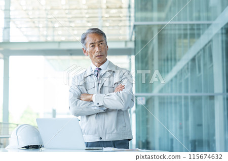 Senior man wearing work clothes Senior man wearing work clothes 115674632