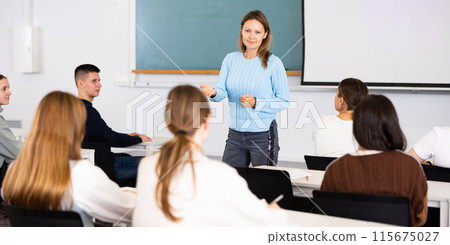 Female teacher teaching high school students in school classroom 115675027