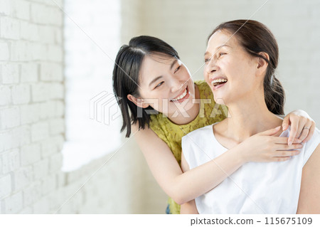 Portrait of a senior woman and her daughter 115675109