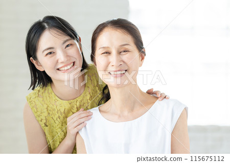 Portrait of a senior woman and her daughter Portrait of a senior woman and her daughter 115675112