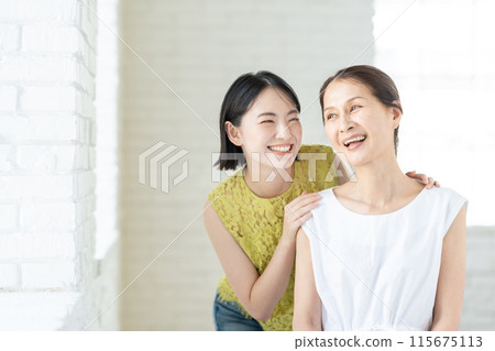 Portrait of a senior woman and her daughter Portrait of a senior woman and her daughter 115675113