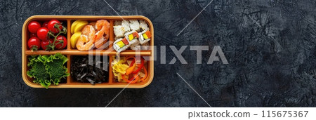 Wooden bento box with assorted sushi and sashimi. 115675367