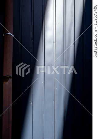 Light shines on the tin wall Light shines on the tin wall 115675406