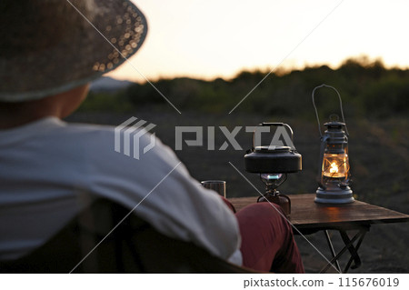 Solo camping at dusk Solo camping at dusk 115676019