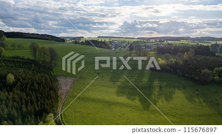 Aerial View of Verdant Fields and Small Village in Hautes Fagnes, Belgium Aerial View of Verdant Fields and Small Village in Hautes Fagnes, Belgium 115676897