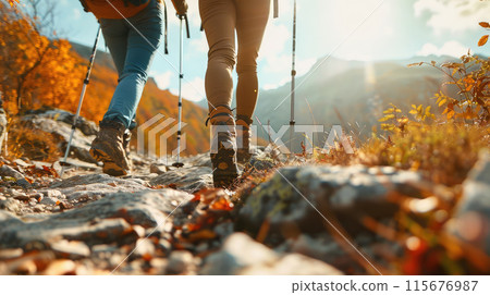 Two hikers enjoying a sunny autumn day on trail Two hikers enjoying a sunny autumn day on trail 115676987