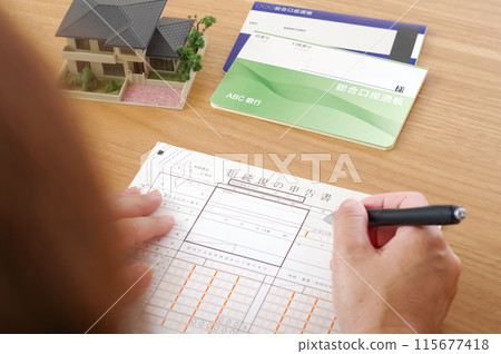 A woman filling out an inheritance tax return 115677418