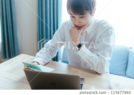 Men seeing passbooks 115677860