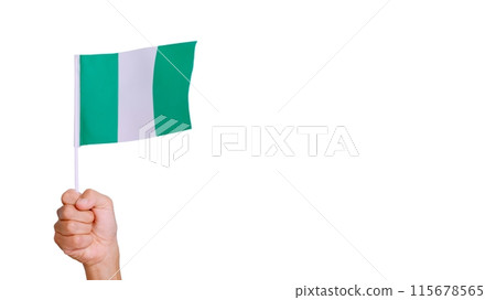 Wind waving a nigerian pennant holding by a hand Wind waving a nigerian pennant holding by a hand 115678565