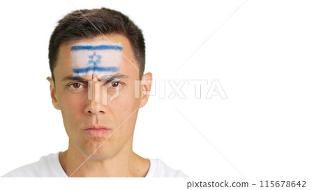 Serious man with a israeli flag painted on the face 115678642