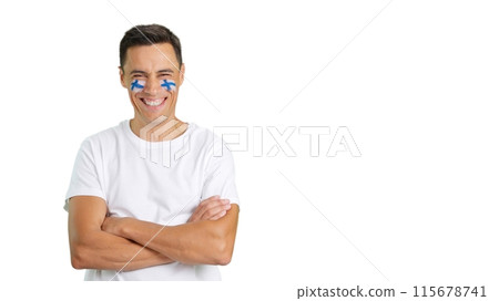 Man standing with finnish flag painted on face smiling Man standing with finnish flag painted on face smiling 115678741