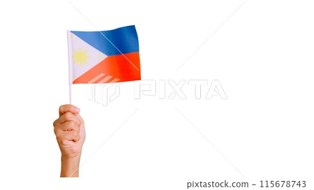 Wind waving a philippine pennant holding by a hand Wind waving a philippine pennant holding by a hand 115678743
