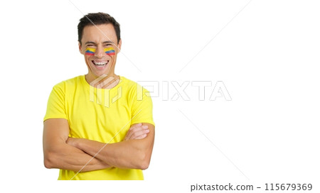 Man standing with colombian flag painted on face smiling 115679369