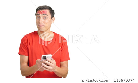 China supporter looking at his mobile smiling and showing it. 115679374