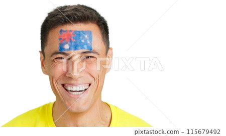 Man with a australian flag painted on the face smiling 115679492