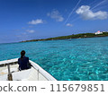 Blue sea of coral reefs - People on a boat watching the sunset 115679851