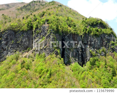 A spectacular view of fresh greenery and rocky cliffs in Yonago Valley in early summer A spectacular view of fresh greenery and rocky cliffs in Yonago Valley in early summer 115679990