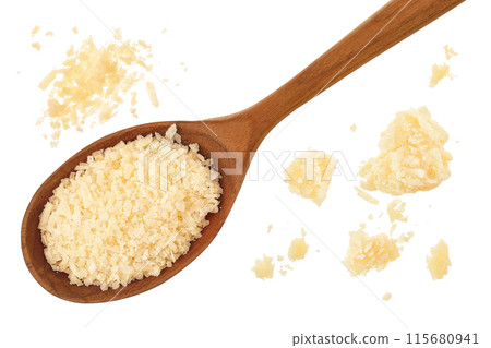 grated parmesan cheese in wooden spoon isolated on white background. Top view. Flat lay. 115680941