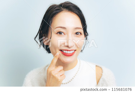 Women showing white teeth Dental care Whitening 115681076
