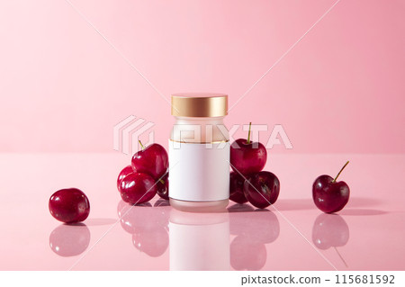 Close-up photo of an unlabeled bottle of health or beauty supplements with golden lid, displayed on the table and decorated with ripe cherry in back, against pink color background Close-up photo of an unlabeled bottle of health or beauty supplements with golden lid, displayed on the table and decorated with ripe cherry in back, against pink color background 115681592