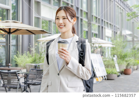 Business woman commuting with a backpack 115682357