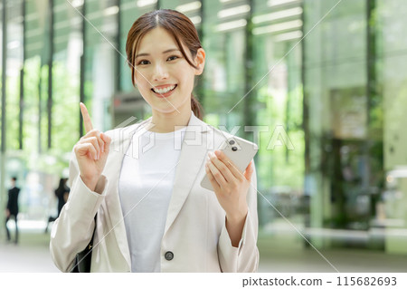 Young woman searching on her smartphone Young woman searching on her smartphone 115682693